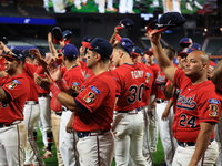 New York's Bravest acknowledge fans after the baseball game against the NYPD baseball team in the 'Battle of Badges' at Citi Field in Corona...