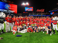 New York's Bravest players pose for a photo after defeating the NYPD baseball team 5-1 in the 'Battle of Badges' at Citi Field in Corona, Ne...