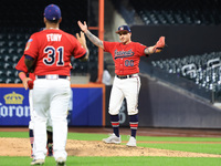 Josh Burgos #00 of New York's Bravest celebrates the final out during the baseball game against the NYPD baseball team in the 'Battle of Bad...