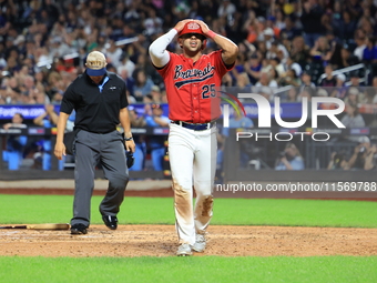 Kevin Diaz #25 of New York's Bravest reacts after being called out at home plate during the baseball game against the NYPD baseball team in...