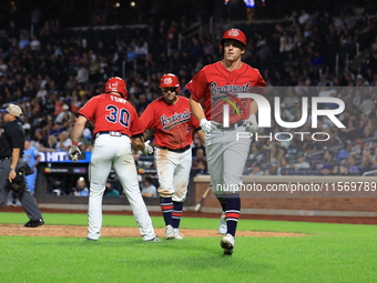 Matt Diorio #14 of New York's Bravest scores during the baseball game against the NYPD baseball team in the 'Battle of Badges' at Citi Field...