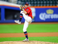 Joe Fiori #33 pitches during the baseball game against the NYPD baseball team in the 'Battle of Badges' at Citi Field in Corona, New York, o...