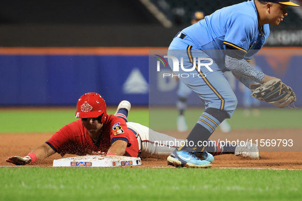 John Giakas #9 of New York's Bravest steals third base during the baseball game against the NYPD baseball team in the 'Battle of Badges' at...