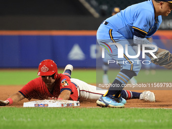 John Giakas #9 of New York's Bravest steals third base during the baseball game against the NYPD baseball team in the 'Battle of Badges' at...