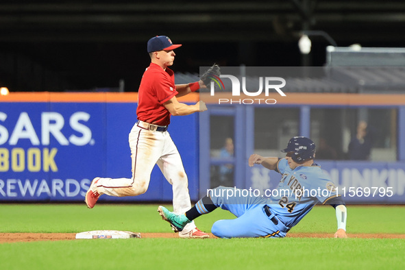 Brian Luebcke #4 fields and throws to first base as PJ Ragone #24 slides into second base during the baseball game against the NYPD baseball...