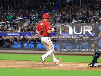 New York's Bravest Brian Luebcke #4 is congratulated after scoring during the baseball game against the NYPD baseball team in the 'Battle of...