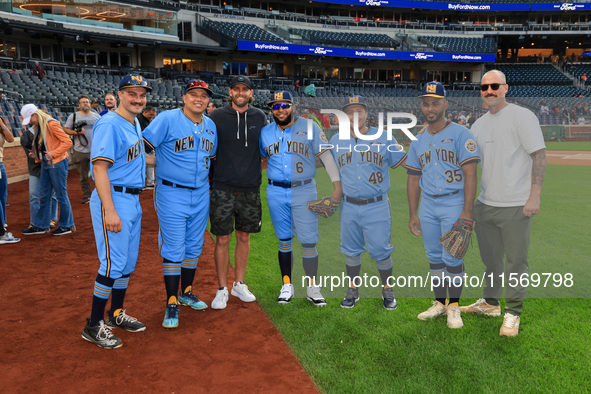 New York's Finest baseball players pose for a photo with New York Mets Jeff McNeil and Sean Reid-Foley before the baseball game against the...