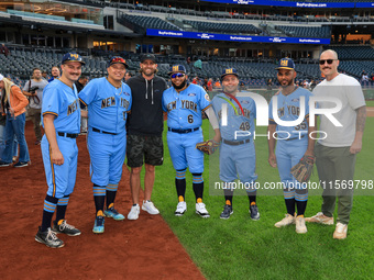 New York's Finest baseball players pose for a photo with New York Mets Jeff McNeil and Sean Reid-Foley before the baseball game against the...