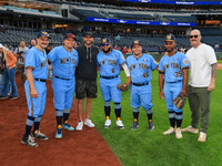 New York's Finest baseball players pose for a photo with New York Mets Jeff McNeil and Sean Reid-Foley before the baseball game against the...