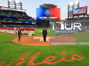 The national anthem is performed before the 'Battle of Badges' at Citi Field in Corona, N.Y., on September 12, 2024. (