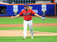 Tim Panetta #1, a pitcher for New York's Bravest, reacts as he comes off the field during the seventh inning of the baseball game against th...