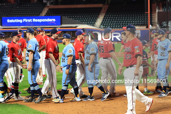 New York's Bravest exchanges handshakes with New York's Finest after the 'Battle of Badges' at Citi Field in Corona, New York, on September...