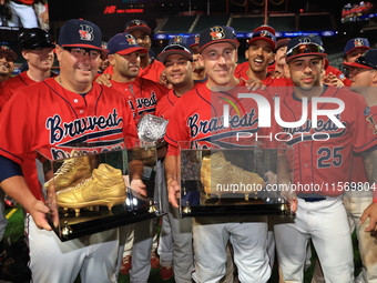 Tom Reznick #22 and Dan Quinn #34 hold retired golden spikes after playing their final game after the 'Battle of Badges' at Citi Field in Co...