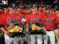 Tom Reznick #22 and Dan Quinn #34 hold retired golden spikes after playing their final game after the 'Battle of Badges' at Citi Field in Co...