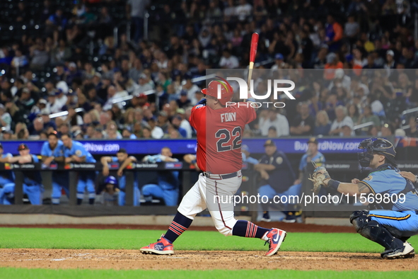 Tom Reznick #22 of New York's Bravest singles during the baseball game against the NYPD baseball team in the 'Battle of Badges' at Citi Fiel...