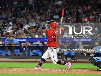 Tom Reznick #22 of New York's Bravest singles during the baseball game against the NYPD baseball team in the 'Battle of Badges' at Citi Fiel...