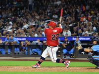 Tom Reznick #22 of New York's Bravest singles during the baseball game against the NYPD baseball team in the 'Battle of Badges' at Citi Fiel...