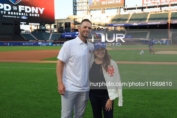 Former New York Mets player David Wright and team owner Alex Cohen pose for a photo before the 'Battle of Badges' at Citi Field in Corona, N...