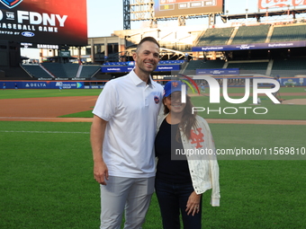 Former New York Mets player David Wright and team owner Alex Cohen pose for a photo before the 'Battle of Badges' at Citi Field in Corona, N...