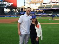 Former New York Mets player David Wright and team owner Alex Cohen pose for a photo before the 'Battle of Badges' at Citi Field in Corona, N...