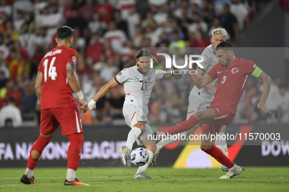 Merih Demiral of Turkey and Arnor Ingvi Traustason of Iceland   during the UEFA Nations League 2024/25 League B Group B4 match between Turki...