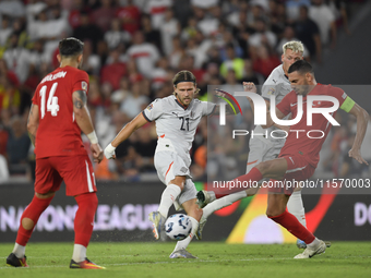 Merih Demiral of Turkey and Arnor Ingvi Traustason of Iceland   during the UEFA Nations League 2024/25 League B Group B4 match between Turki...