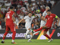 Merih Demiral of Turkey and Arnor Ingvi Traustason of Iceland   during the UEFA Nations League 2024/25 League B Group B4 match between Turki...