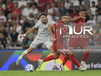 Arnor Ingvi Traustason  and Merih Demiral  during the UEFA Nations League 2024/25 League B Group B4 match between Turkiye and Iceland at Gür...