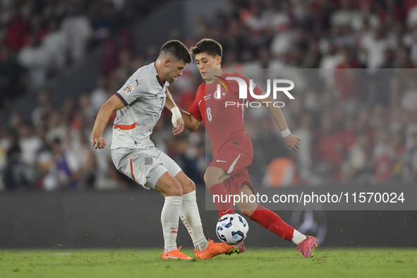 Johann Gudmundsson of Iceland and Arda Guler of Turkey   during the UEFA Nations League 2024/25 League B Group B4 match between Turkiye and...