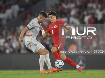 Johann Gudmundsson of Iceland and Arda Guler of Turkey   during the UEFA Nations League 2024/25 League B Group B4 match between Turkiye and...