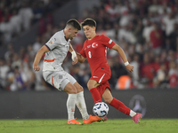 Johann Gudmundsson of Iceland and Arda Guler of Turkey   during the UEFA Nations League 2024/25 League B Group B4 match between Turkiye and...