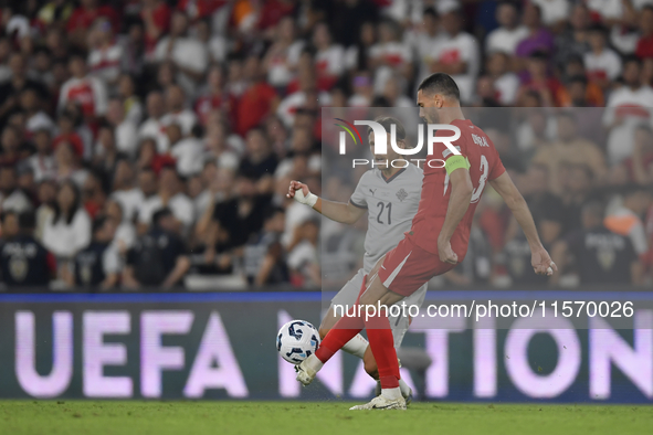 Merih Demiral of Turkey and Arnor Ingvi Traustason of Iceland   during the UEFA Nations League 2024/25 League B Group B4 match between Turki...