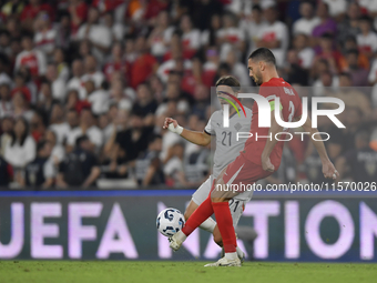 Merih Demiral of Turkey and Arnor Ingvi Traustason of Iceland   during the UEFA Nations League 2024/25 League B Group B4 match between Turki...