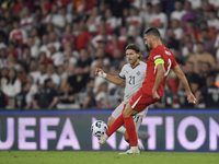 Merih Demiral of Turkey and Arnor Ingvi Traustason of Iceland   during the UEFA Nations League 2024/25 League B Group B4 match between Turki...