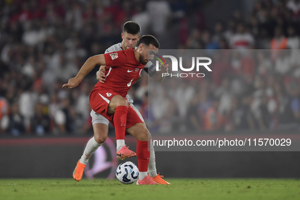 Orkun Kokcu of Turkey and Johann Gudmundsson of Iceland   during the UEFA Nations League 2024/25 League B Group B4 match between Turkiye and...