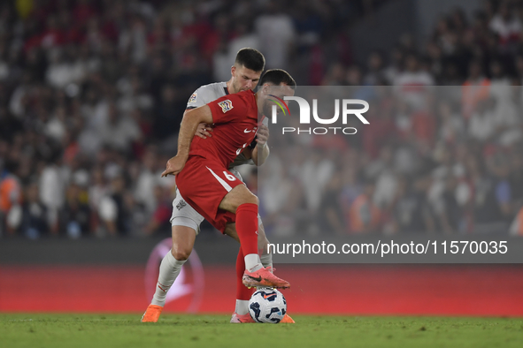 Johann Gudmundsson of Iceland and Orkun Kokcu of Turkey   during the UEFA Nations League 2024/25 League B Group B4 match between Turkiye and...