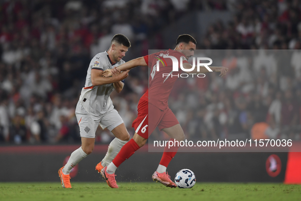 Johann Gudmundsson of Iceland and Orkun Kokcu of Turkey   during the UEFA Nations League 2024/25 League B Group B4 match between Turkiye and...