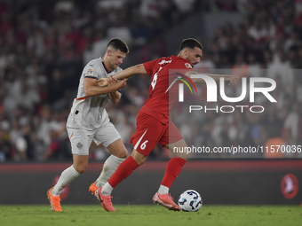 Johann Gudmundsson of Iceland and Orkun Kokcu of Turkey   during the UEFA Nations League 2024/25 League B Group B4 match between Turkiye and...