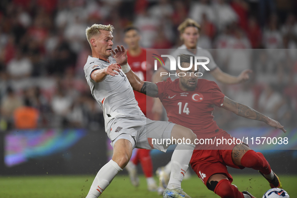 Abdulkerim Bardakci of Turkey and Orri Oskarsson of Iceland   during the UEFA Nations League 2024/25 League B Group B4 match between Turkiye...