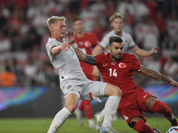 Abdulkerim Bardakci of Turkey and Orri Oskarsson of Iceland   during the UEFA Nations League 2024/25 League B Group B4 match between Turkiye...