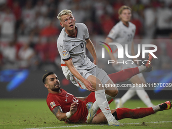 Abdulkerim Bardakci of Turkey and Orri Oskarsson of Iceland   during the UEFA Nations League 2024/25 League B Group B4 match between Turkiye...