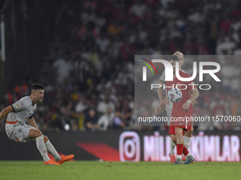 Ismail Yuksek of Turkey and Johann Gudmundsson of Iceland   during the UEFA Nations League 2024/25 League B Group B4 match between Turkiye a...