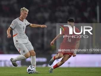 Ismail Yuksek of Turkey and Orri Oskarsson of Iceland  during the UEFA Nations League 2024/25 League B Group B4 match between Turkiye and Ic...