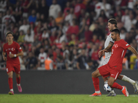 Zeki Celik of Turkey and Johann Gudmundsson of Iceland   during the UEFA Nations League 2024/25 League B Group B4 match between Turkiye and...