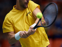 Thanasi Kokkinakis of Australia is in action during the game against Jakub Mensik of Czechia during the 2024 Davis Cup Group B Stage match b...