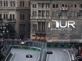 Lewis Hamilton of Mercedes and Charles Leclerc of Ferrari during first practice ahead of the Formula 1 Grand Prix of Azerbaijan at Baku City...