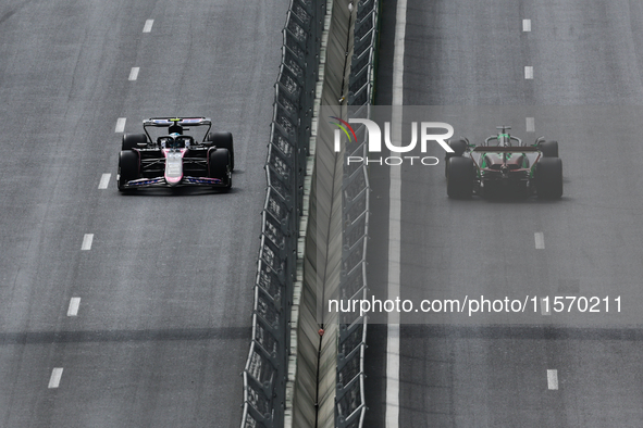 Pierre Gasly of Alpine and Valtteri Bottas of Kick Sauber during first practice ahead of the Formula 1 Grand Prix of Azerbaijan at Baku City...