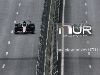 Pierre Gasly of Alpine and Valtteri Bottas of Kick Sauber during first practice ahead of the Formula 1 Grand Prix of Azerbaijan at Baku City...