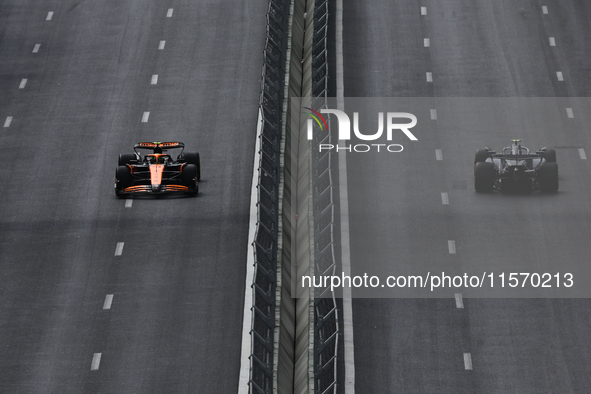 Lando Norris of McLaren and Franco Colapinto of Williams during first practice ahead of the Formula 1 Grand Prix of Azerbaijan at Baku City...