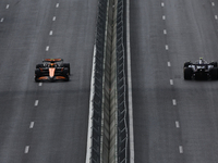 Lando Norris of McLaren and Franco Colapinto of Williams during first practice ahead of the Formula 1 Grand Prix of Azerbaijan at Baku City...